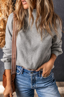 Grey turtleneck knit sweater with dropped shoulders and bubble sleeves