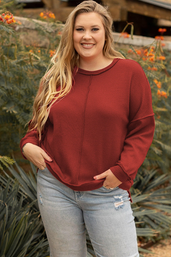 Plus size waffle knit top with exposed seams and gold flame