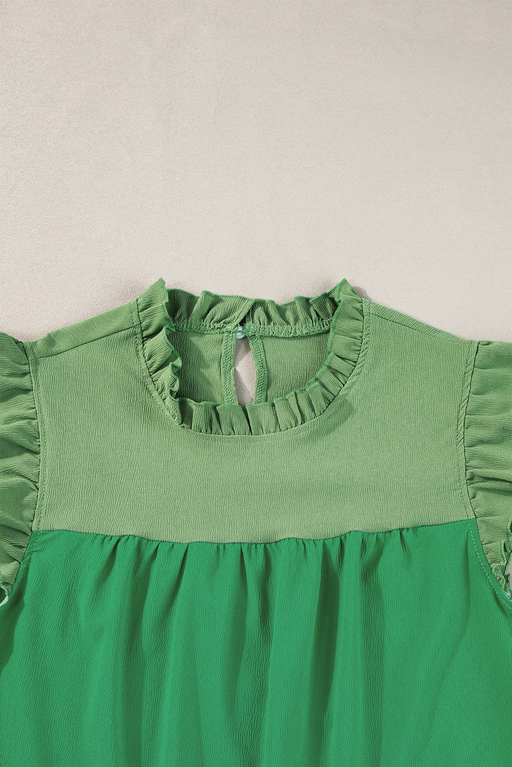 Blouse à manches à manches brillantes à deux tons vert brillant