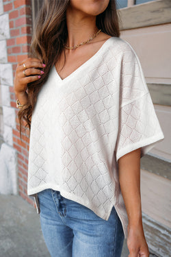 Fluid white knitted blouse with v -neck collar