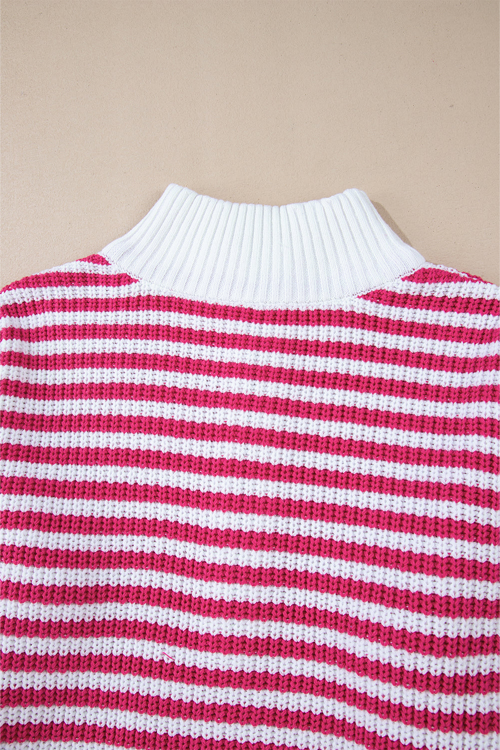 Pink striped sweater, zipped collar, dropped shoulders