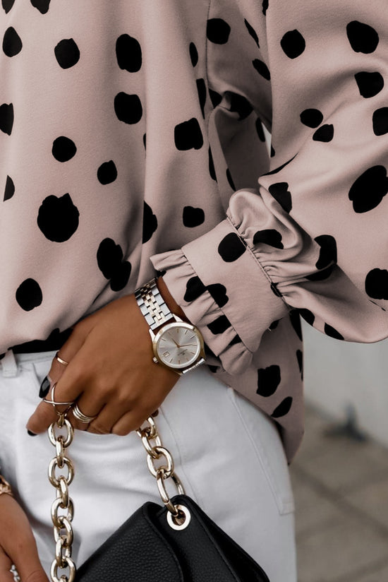 Surprised pink blouse with puffy sleeves and ruffle cuffs