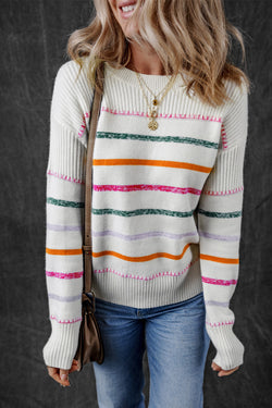 White sweater with colored stripes and ribbed borders