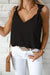 Chaleco negro con hombro anudado y v -neck