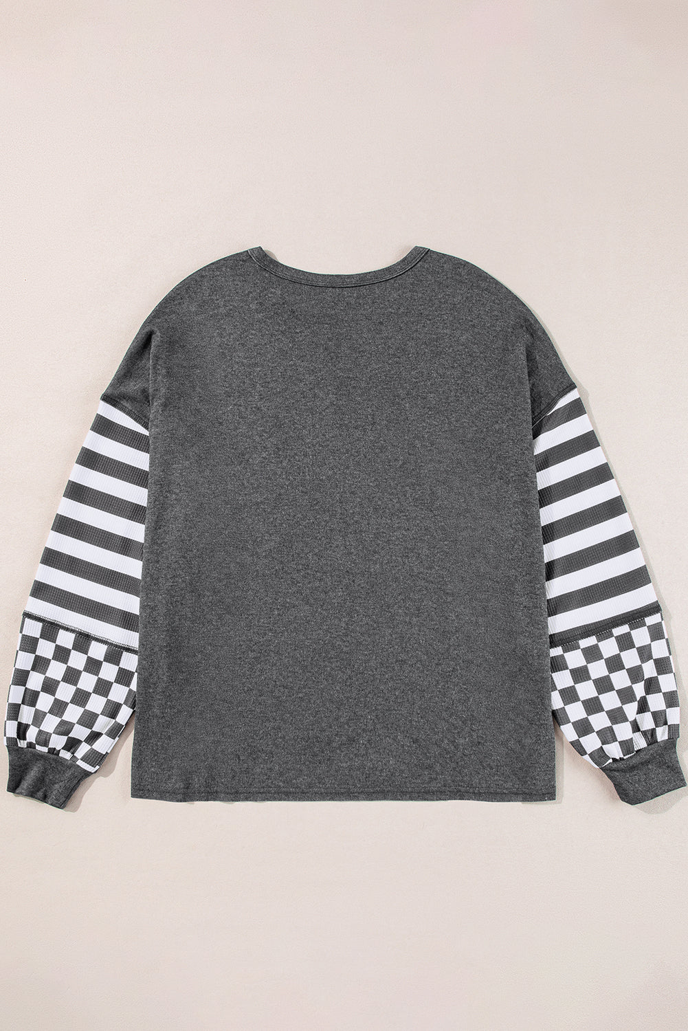 Chemisier gris foncé à poches et manches lanternes en patchwork rayé en damier