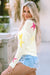 White loose sweater with colorful star pattern