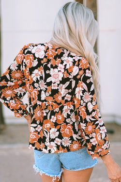 Brown babydoll blouse with floral print and 3/4 sleeves