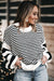 Black and white striped bishop sleeve drop shoulder knit sweater