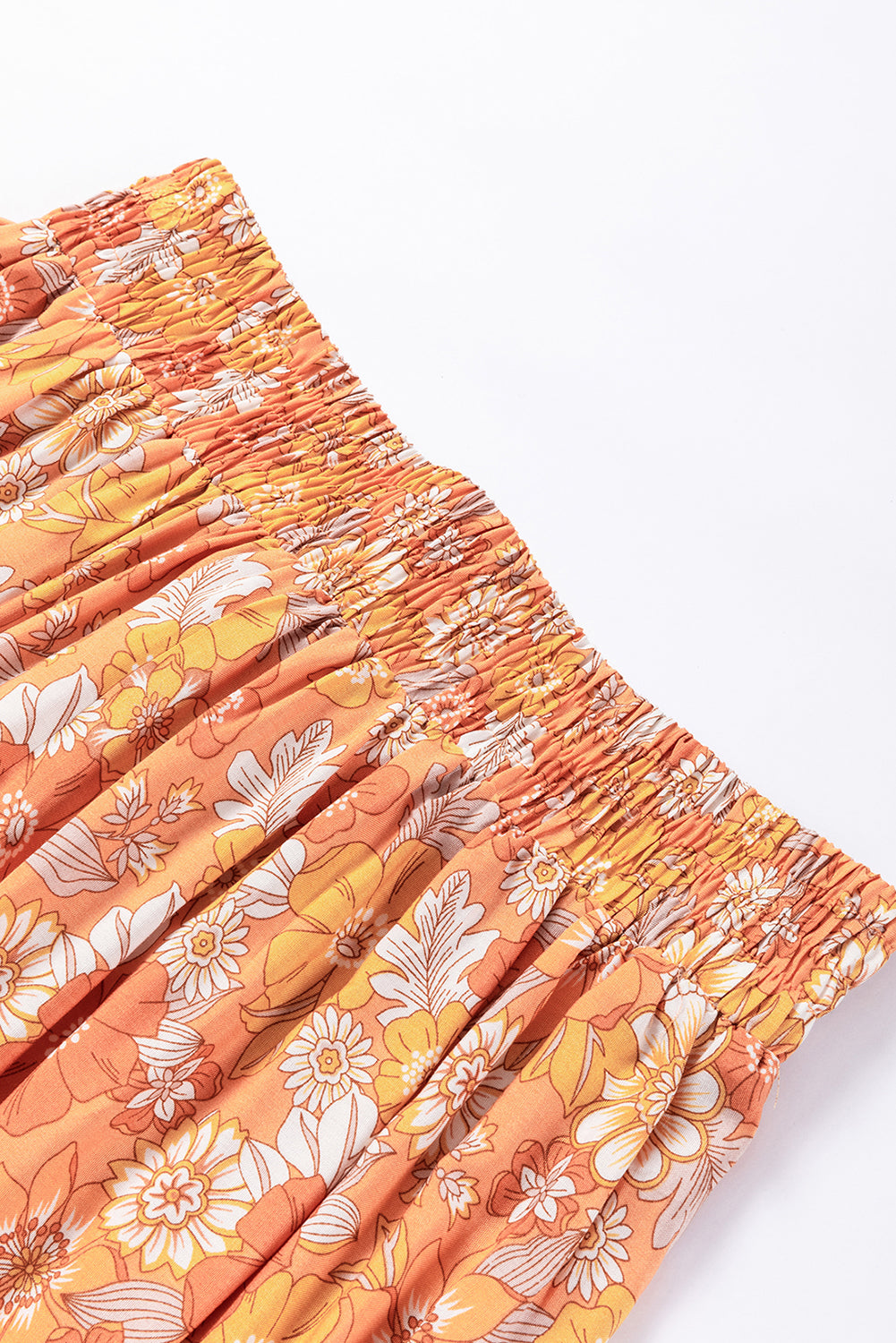 Pantalones anchos con estampado floral bohemio y cintura anudada en naranja pomelo