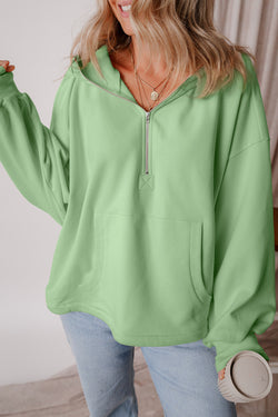 Loose fitting half zip hoodie with kangaroo pockets lined with smoke green fleece