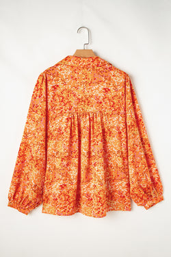 Babydoll orange blouse in V -collar and abstract print