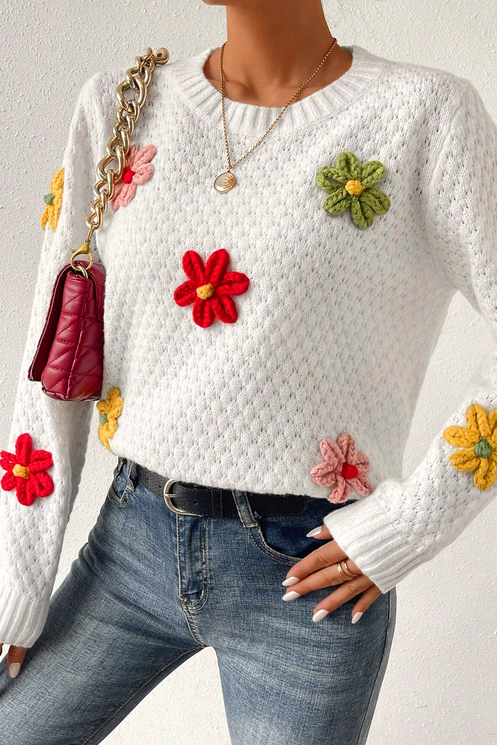 Textured knit sweater with white colorful flower appliques