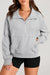 Light gray sweatshirt with stand-up collar and kangaroo pocket with quarter-turn zip