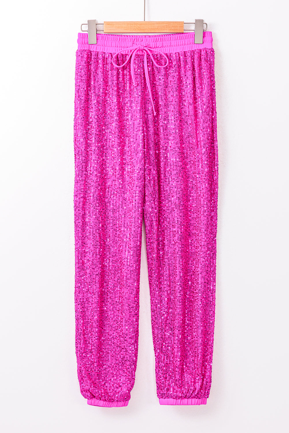 Pantalones jogger con lentejuelas y cintura alta con lazo rosa