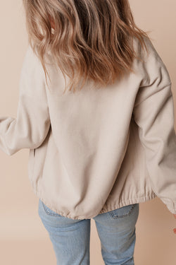 Chaqueta aviador beige con bolsillos y collar de béisbol