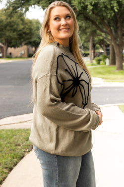 Plus size dark khaki sweater with large flower pattern, high neck, dropped shoulders