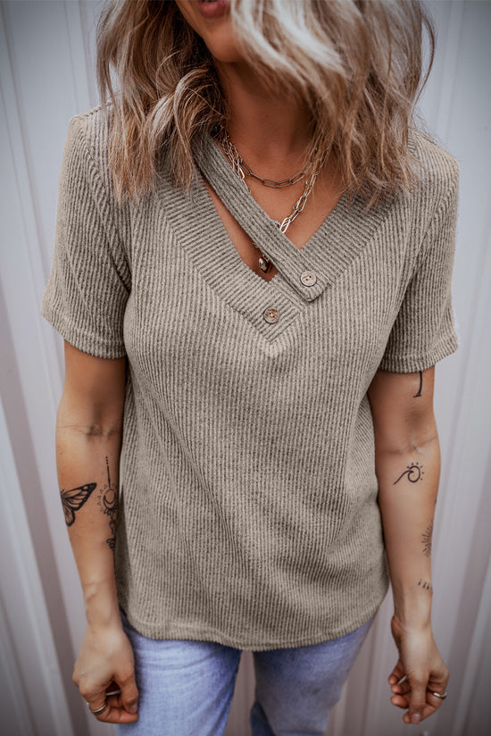 Pale chopped khaki t-shirt with buttoned suspenders and v-collar