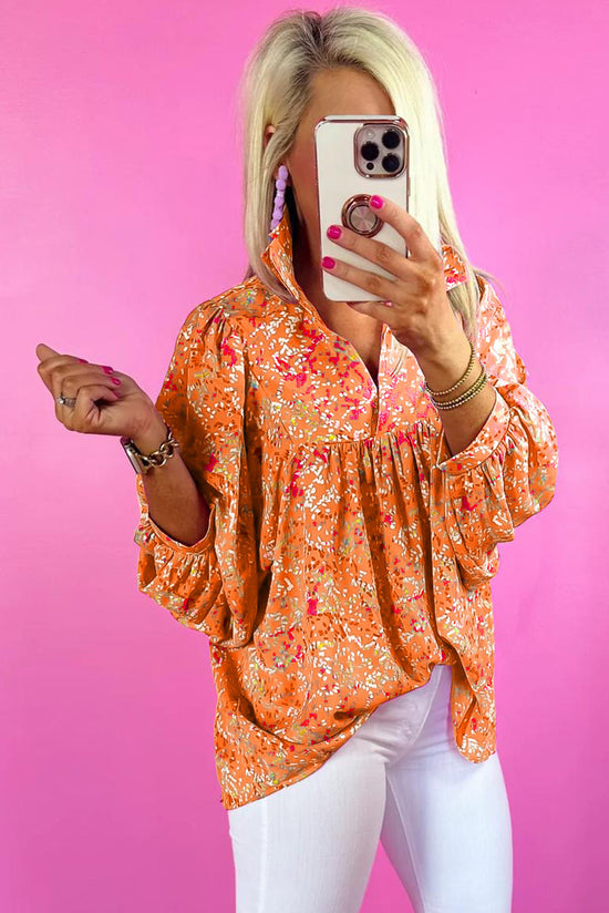 Babydoll orange blouse in V -collar and abstract print