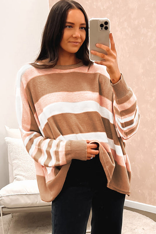 Ample knitting sweater with multicolored stripes with drooping shoulders