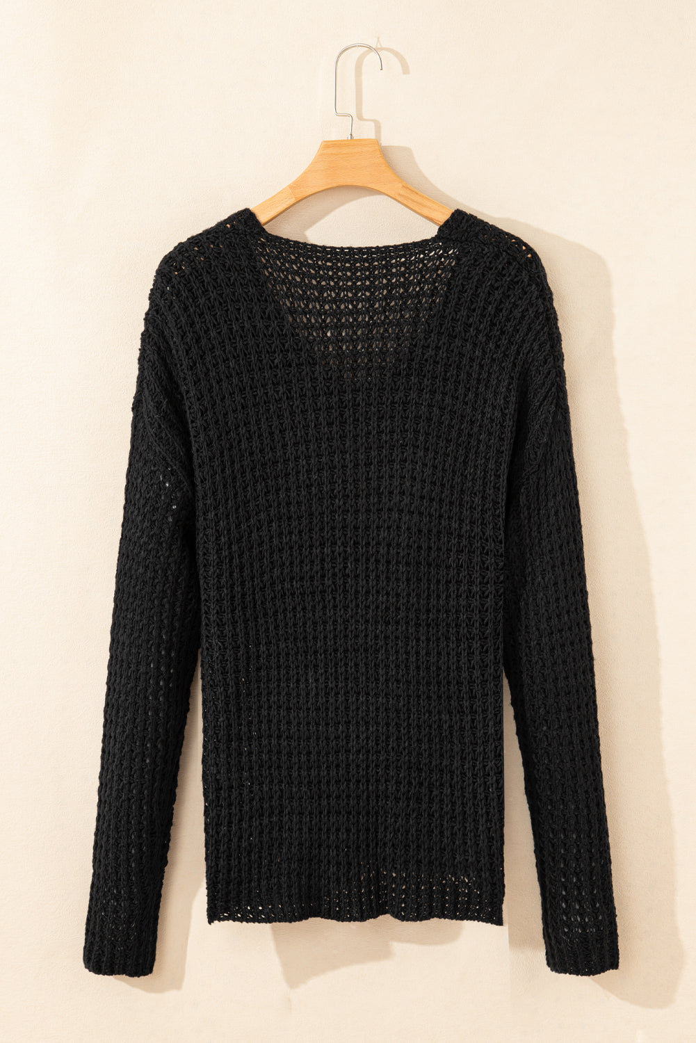 Black V-neck sweater with openwork crochet