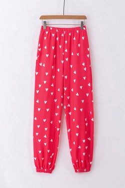 Pantalones rojos brillantes con estampado de corazón para el Día de San Valentín