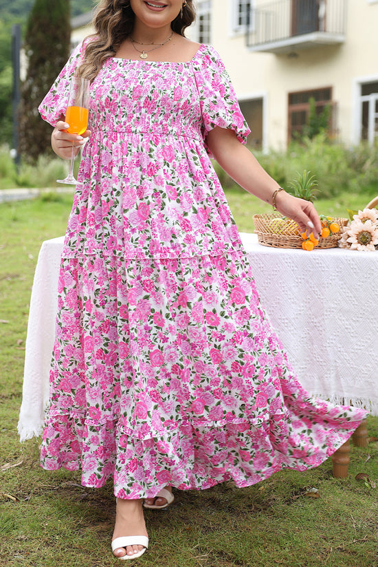 Smocked pink dress with puffy sleeves and large floral print