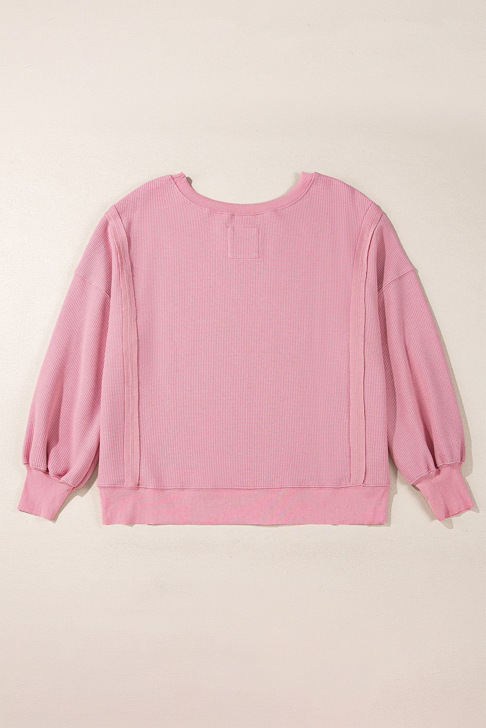 Haut oversize fendu à manches évêque en tricot gaufré rose