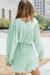 Green V-Neck Pleated Romper with Ruffles and Buttons at the Waist