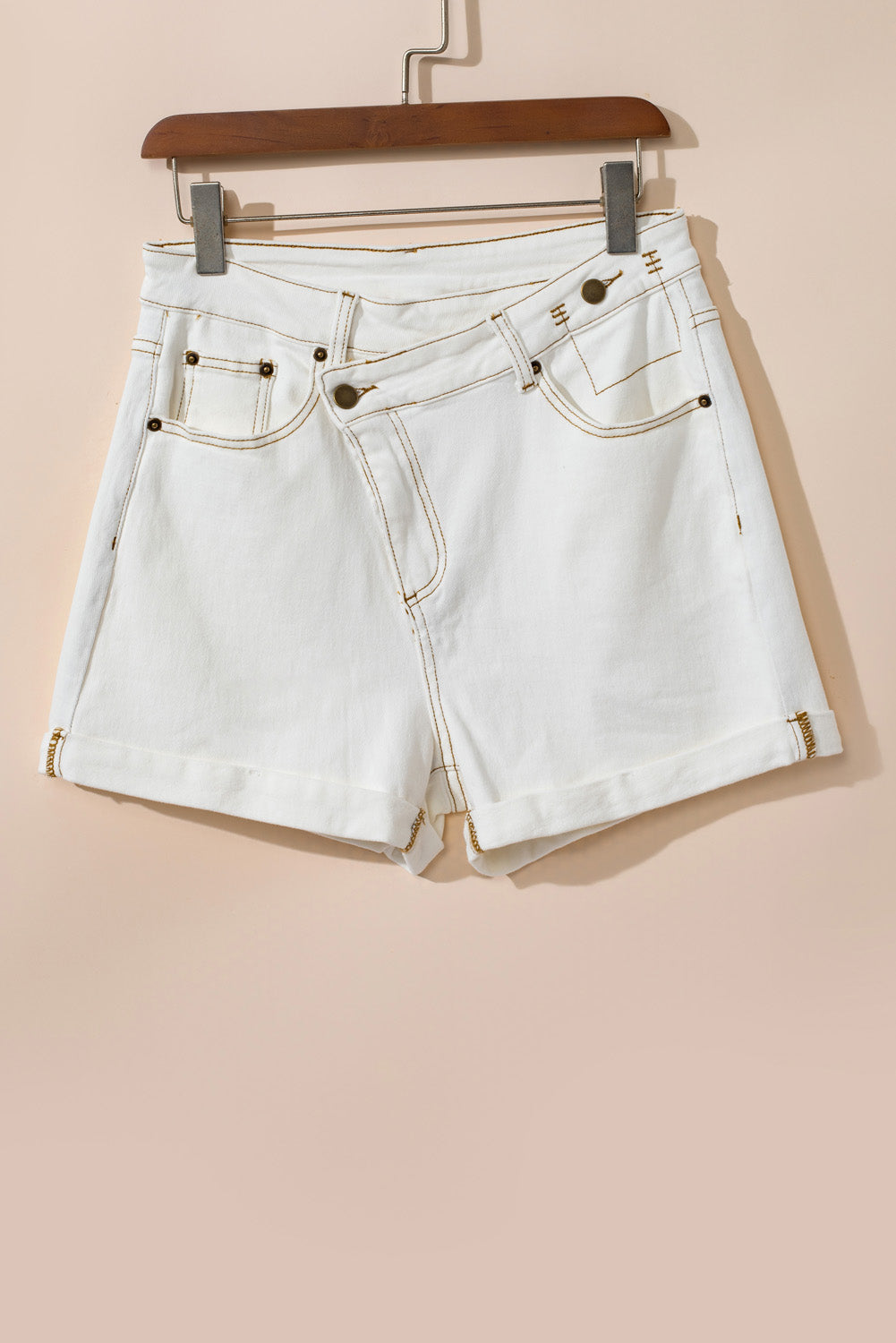 Stylish white denim shorts with asymmetrical waist