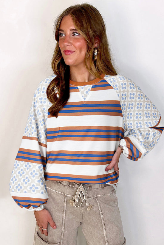 White blouse with lanterns sleeves and striped floral print