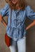 Twilight blue denim shirt tied on the front with bubble and basque sleeves