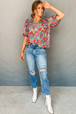 Red blouse with puffy sleeves and ruffles with split collar and floral tie