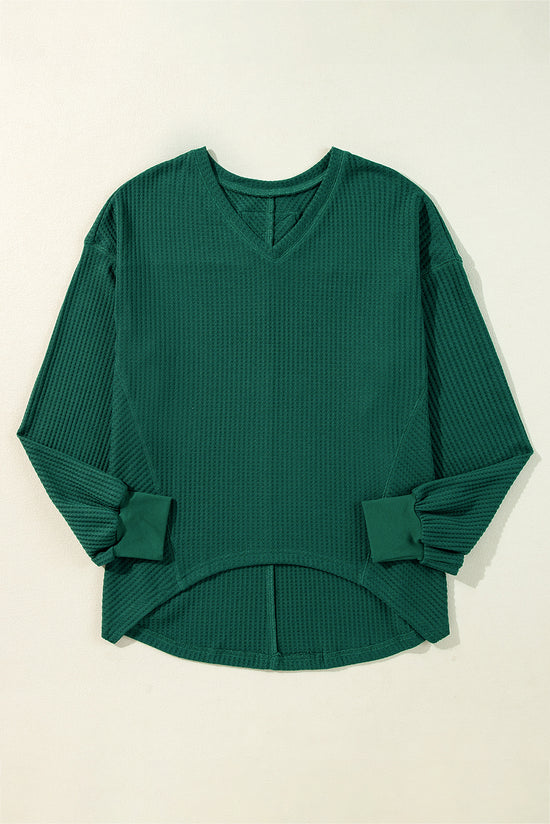 Ample blouse with long sleeves and blackish robe green v for drooping shoulders