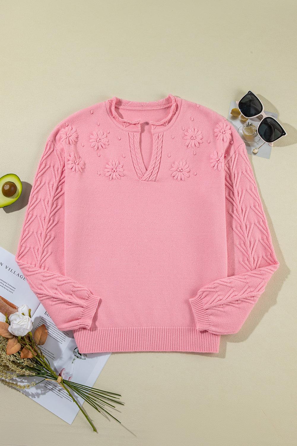 Knitted sweater with notched collar and peach blossom detail