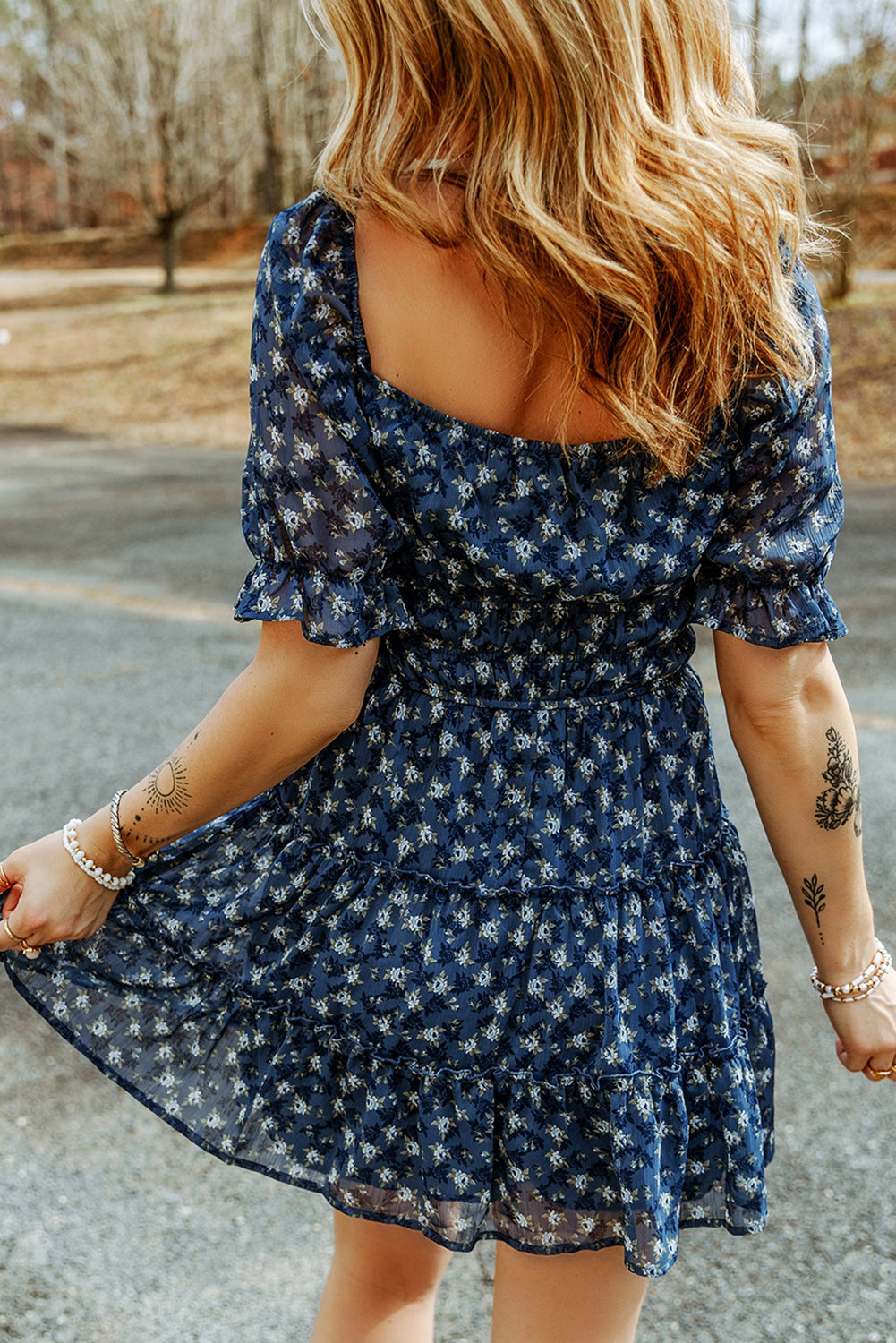 Short dress with ruffles and floral smocking in voile blue