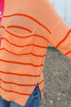 Loose fit knitted sweater with multi-colored stripes