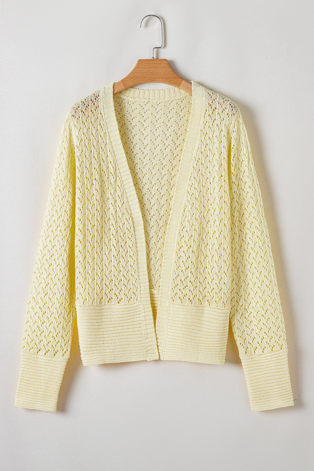 Cardigan court jaune crème en maille pointelle ouvert sur le devant