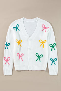 Cardigan boutonné en tricot blanc à épaules tombantes et nœud papillon