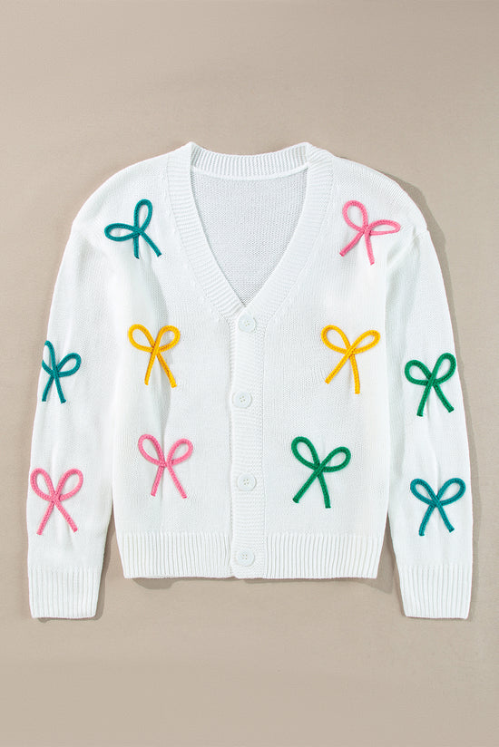 Cardigan boutonné en tricot blanc à épaules tombantes et nœud papillon