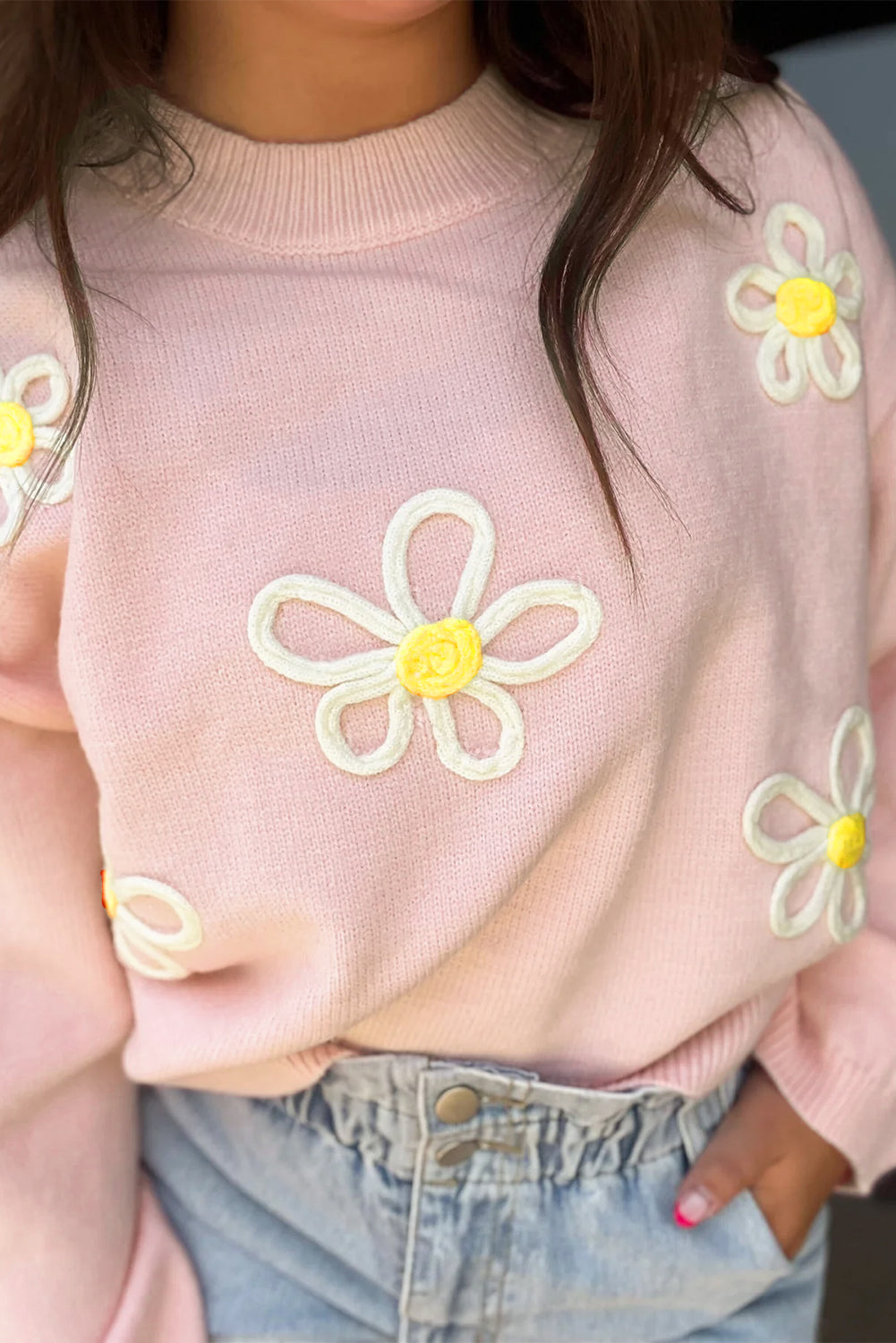 Maglione di cucitura a cucitura a margherita rosa.