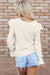 Beige ribbed velvet blouse with ruffles and ruffle sleeves