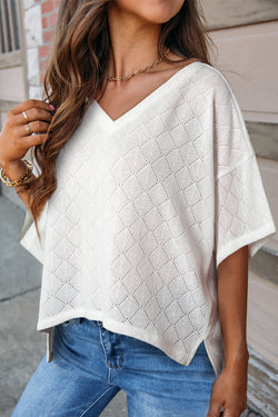 Fluid white knitted blouse with v -neck collar