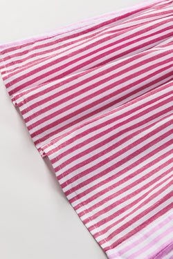 Shirt buttoned with pink stripes and ruffled hem in patchwork