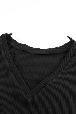 Black long sleeve v-neck top with lace trim and ribbed texture