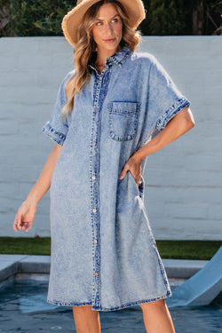 Light blue chambray shirt dress with short sleeves and medium washing