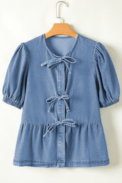 Twilight blue denim shirt tied on the front with bubble and basque sleeves