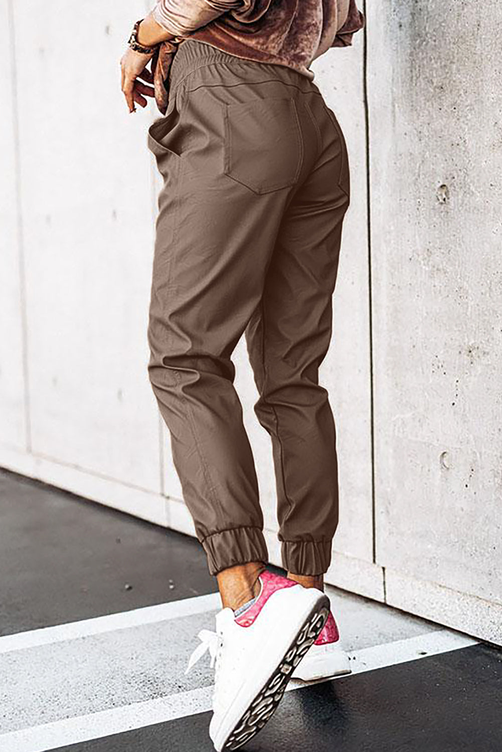 Brown leather jogging pants with waist tie