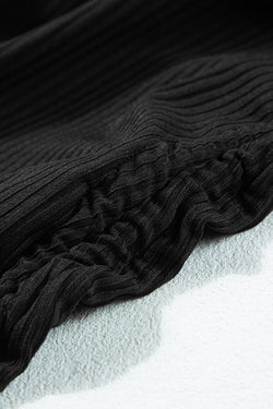 Swimsuit A ribbed black room with tightening cord and cutting on the sides