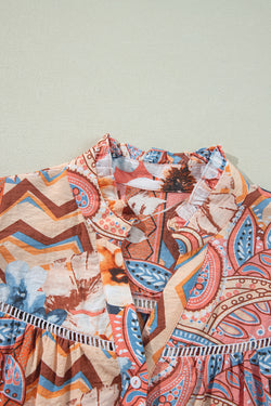 Large shirt buttoned with frowned and orange floral print