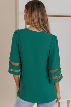 Green loose blouse with flared sleeve and v -collar